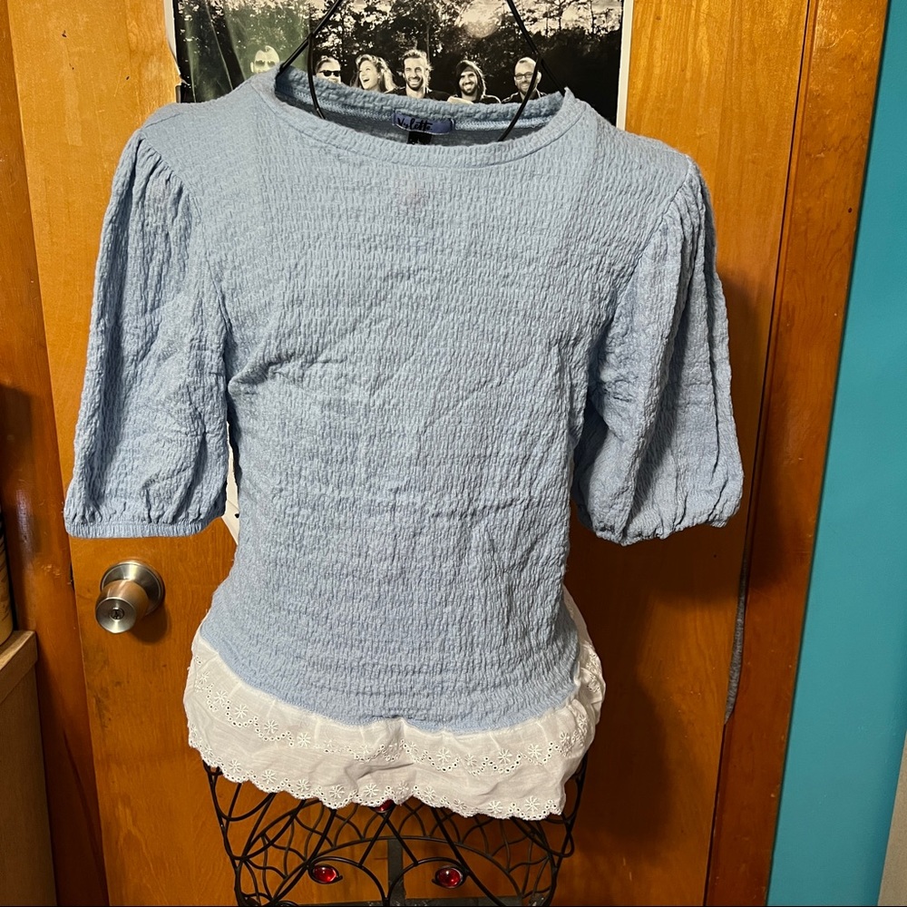 Vylette blue top with white lace detail small tear size large